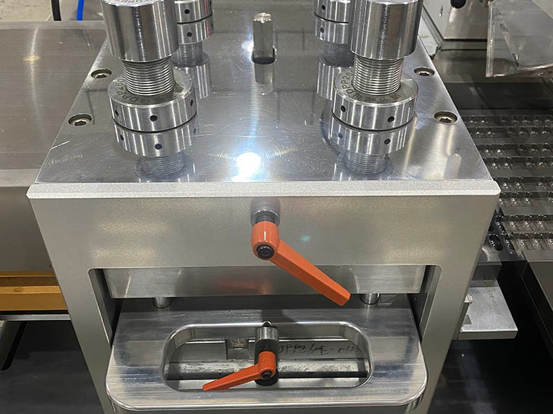 The novel mould orientation mechanism for rapid tool changeover on the blister packing machine.