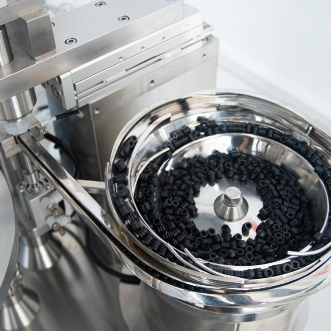 Automatic stopper feeding