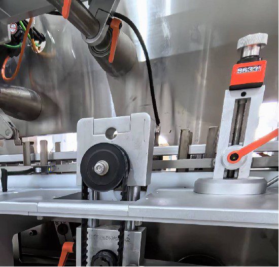 Batch number printing station on a pharmaceutical cartoning machine