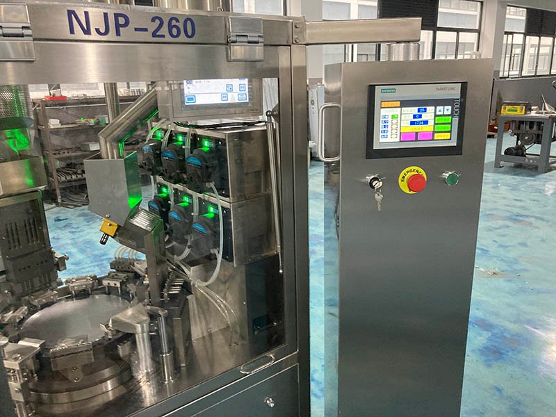 Liquid capsule filling machine side view