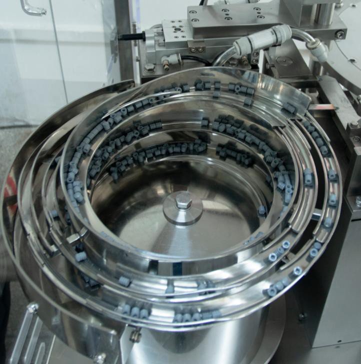 Automatic stopper feeding system