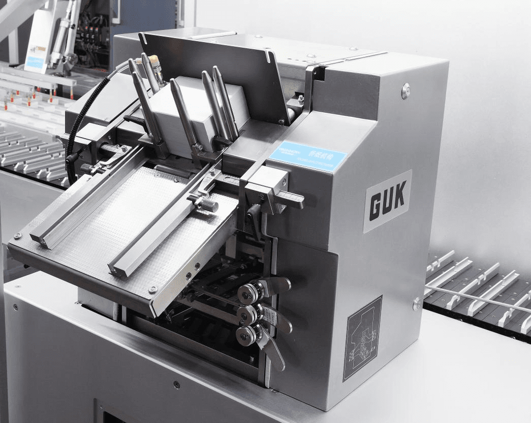 GUK leaflet folding machine on a blister cartoning line during troubleshooting of fold quality