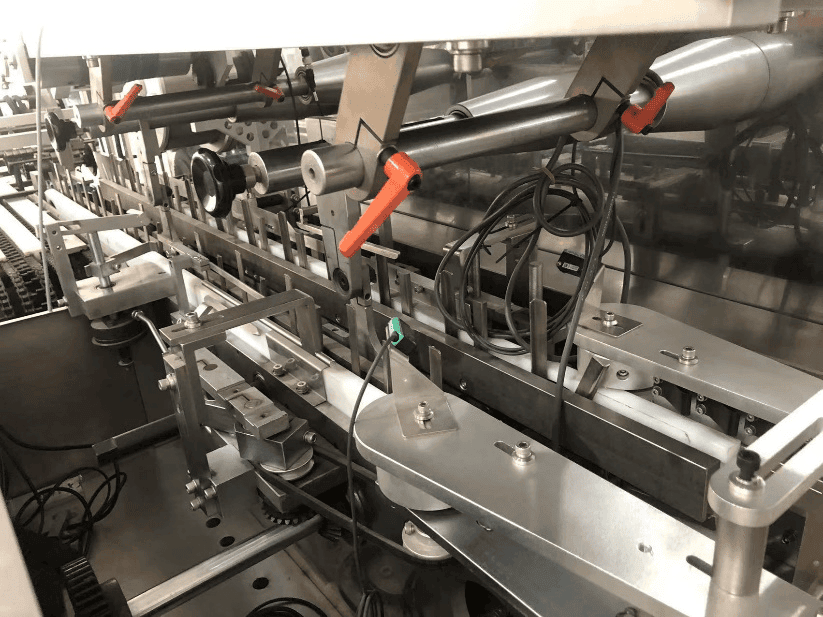 Leaflet folder feeder station with detection sensors on ZH-200 high speed cartoner
