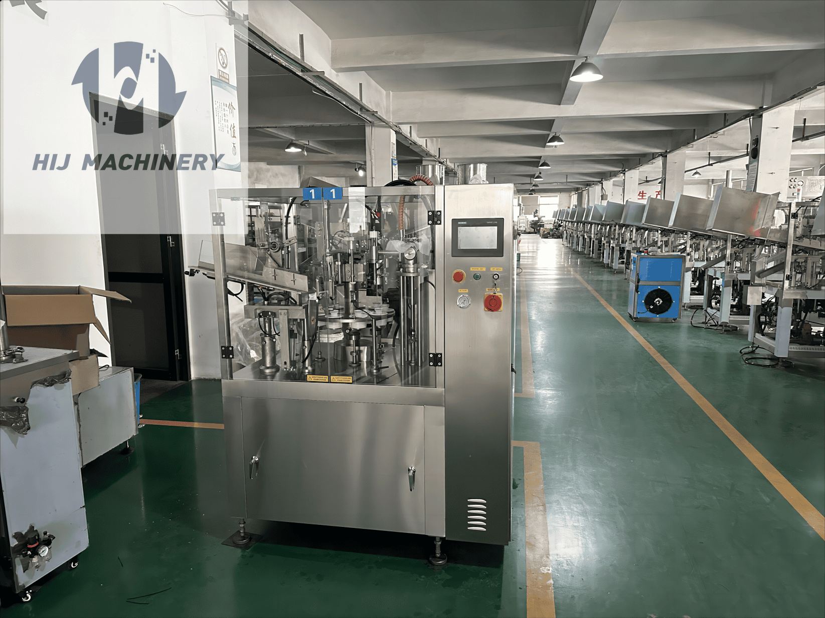 HIJ TF60 tube filling and sealing machine with guarded rotary stations in the workshop
